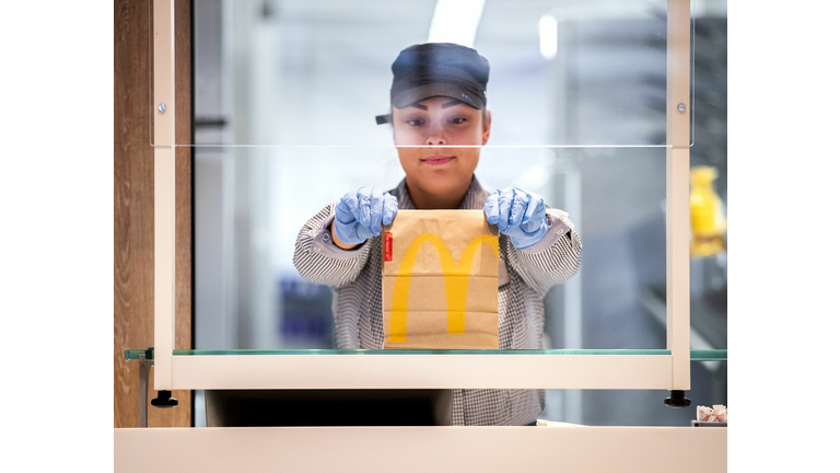 McDonald's Employee Hands Food Through Glass Window