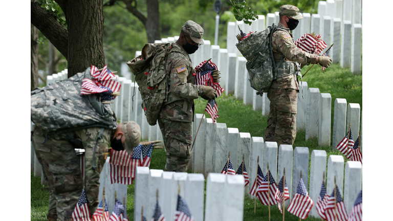 Arlington National Cemetery Holds Annual Flags-In To Honor Fallen For Memorial Day