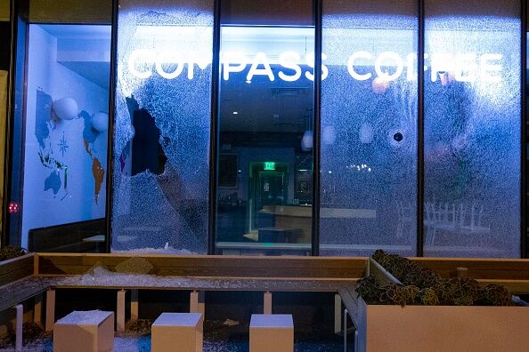 Broken coffee shop window is seen near to the  White House on May 30, 2020 in Washington D.C., during a protest over the death of George Floyd.