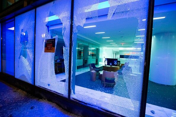 Broken office building window is seen near the White House on May 30, 2020 in Washington D.C.