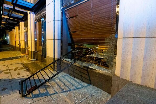 Broken coffee shop window is seen near to the White House on May 30, 2020 in Washington D.C.