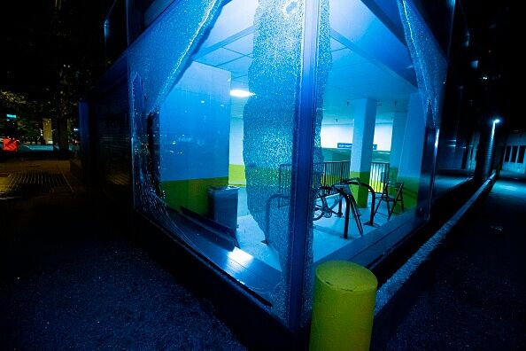 Broken parking lot building window is seen near the White House on May 30, 2020 in Washington D.C.