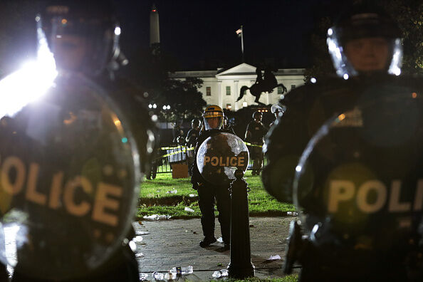 Members of the U.S. Secret Service hold a perimeter near the White House as demonstrators gather to protest the killing of George Floyd on May 30, 2020 in Washington, DC.