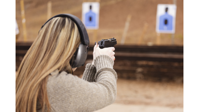 Woman Shooter at the Shooting Range