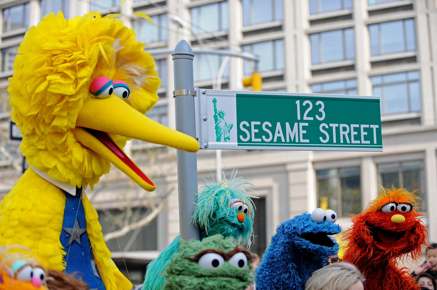 Big Bird (L) and other Sesame Street pup