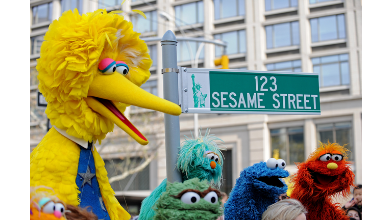 Big Bird (L) and other Sesame Street pup