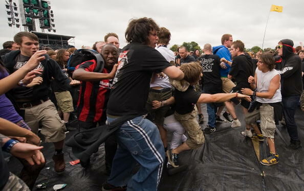 Revellers dance in the "mosh pit" as US