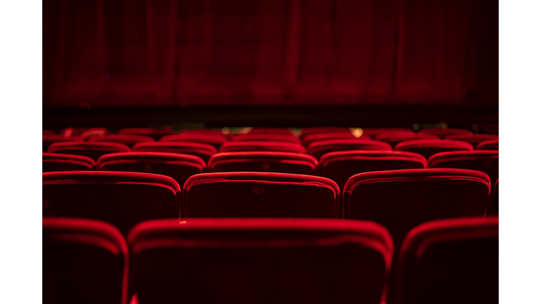 Red seats and curtains of an empty theater