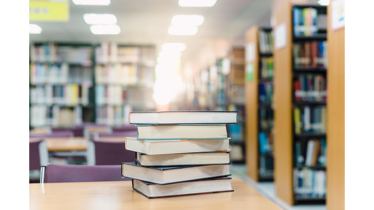 Stack Of Books On Table In Library