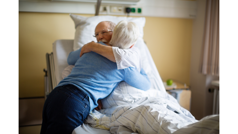 Senior woman visiting her husband in hospital