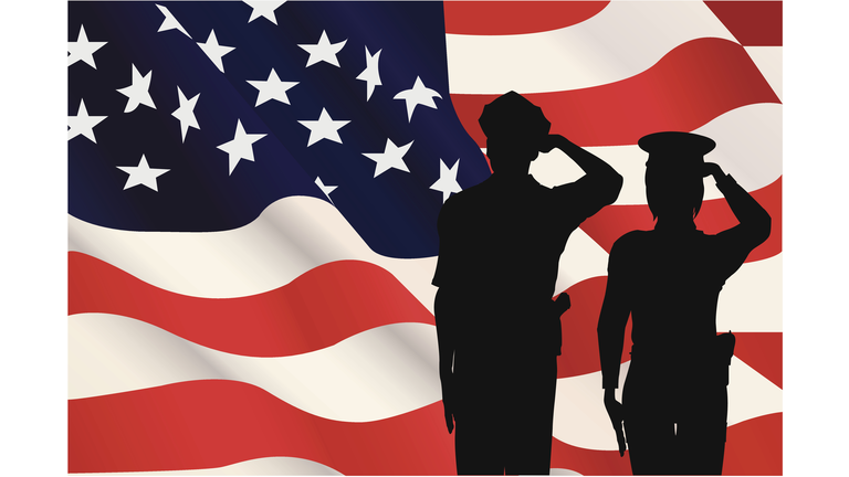 Silhouettes saluting the American flag