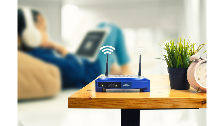 Close-Up Of Wireless Router On Table At Home