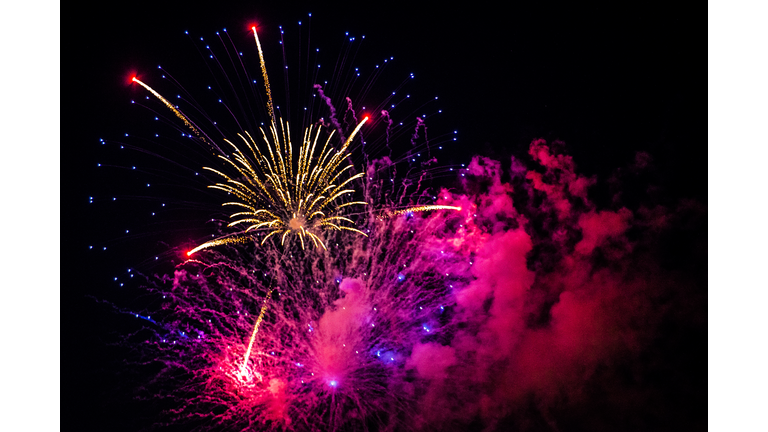 Pink, purple, and white Fourth of July fireworks