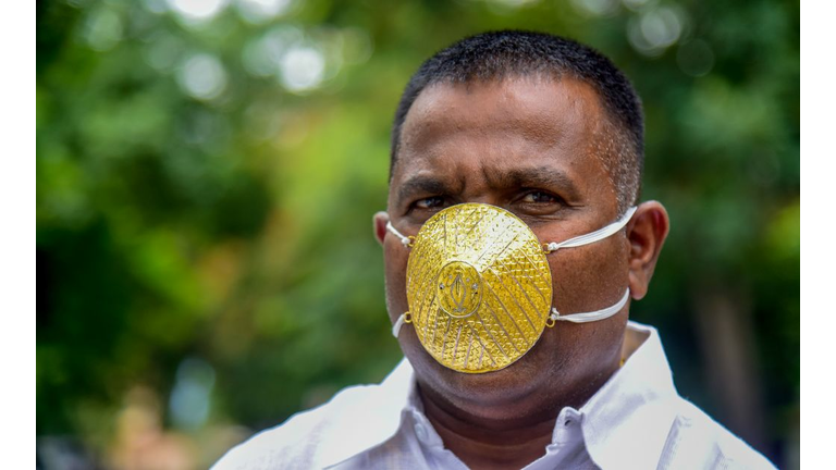 TOPSHOT-INDIA-HEALTH-VIRUS-GOLD