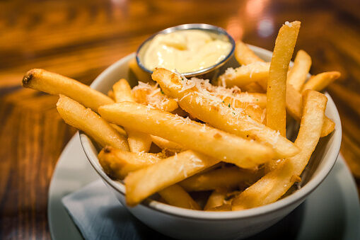Close-up bowl of french fries with mayonnaise dipping