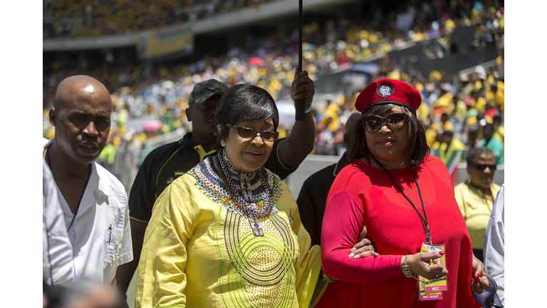 Winnie Madikizela-Mandela, ex-wife of late South African anti-apartheid leader Nelson Mandela, and their daughter Zindzi Mandela (R) arrive to attend South Africa's ruling African National Congress (ANC) party's 103rd birthday celebrations at Cape Town Stadium on January 10, 2015. AFP PHOTO / JENNIFER BRUCE (Photo credit should read JENNIFER BRUCE/AFP via Getty Images)