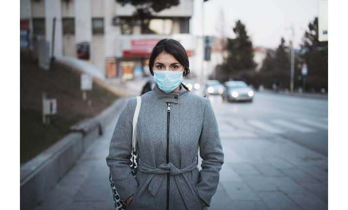 Portrait Of Young Woman With Mask On The Street.