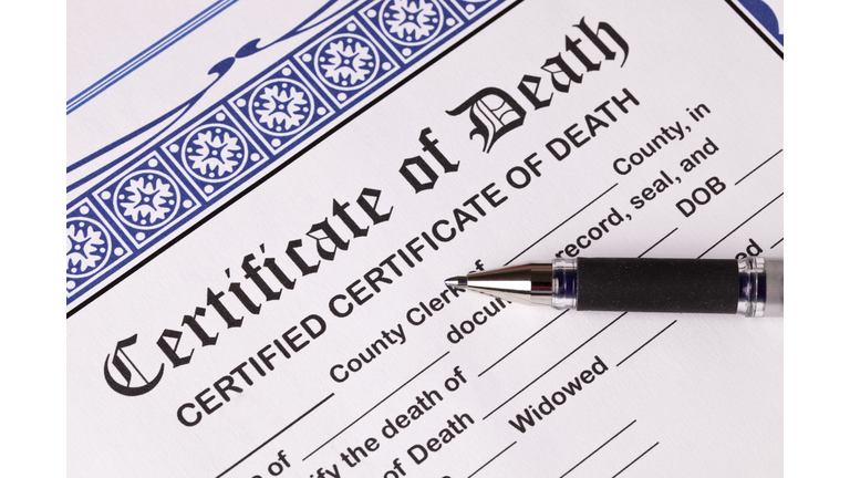 Death Certificate with pen. Close-up of top of certificate