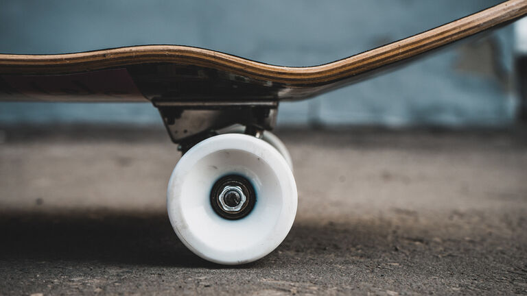 Close-Up Of Skateboard On Land