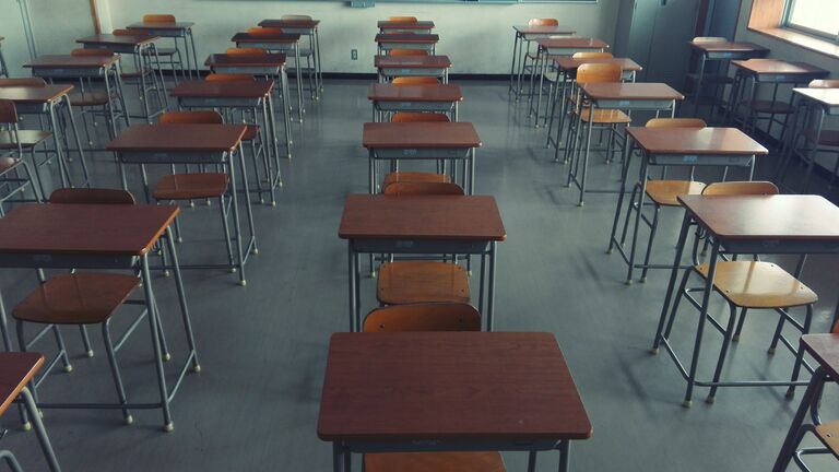 Empty Chairs In Classroom At School