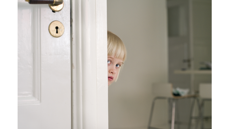 A Girl Peeping Out From Behind A Corner Sweden.