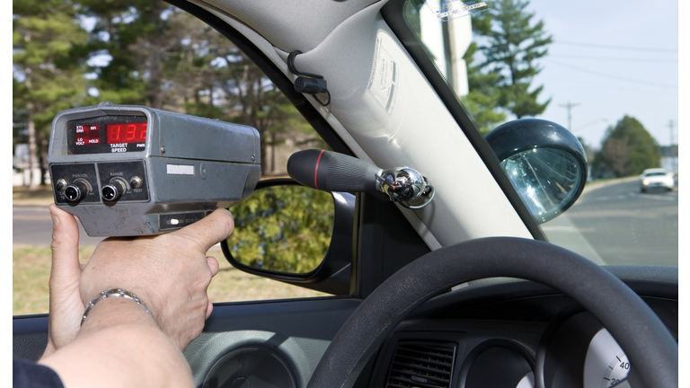 Police Officer Using a Handheld RADAR gun