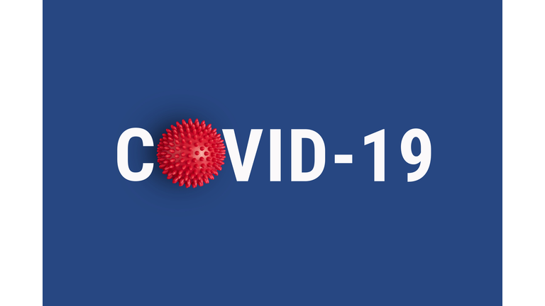 Inscription COVID-19 on blue background with red abstract virus strain model