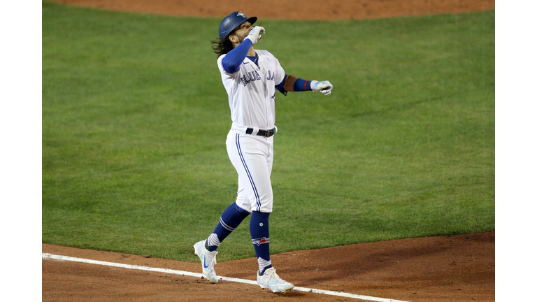 Bo Bichette Celebrates his sixth-inning homer that gave Toronto a 7-4 lead