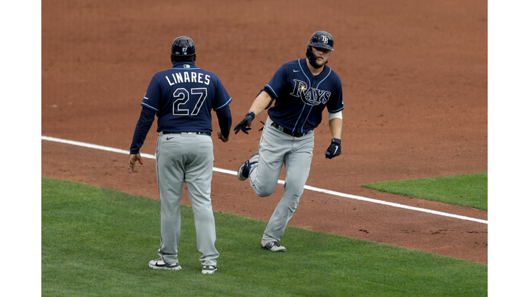 Austin Meadows is congratulated by third-base coach Rodney Linares after Meadows' third-inning home run