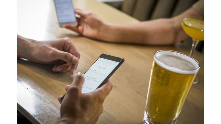 Man looking online menu in rastaurant.