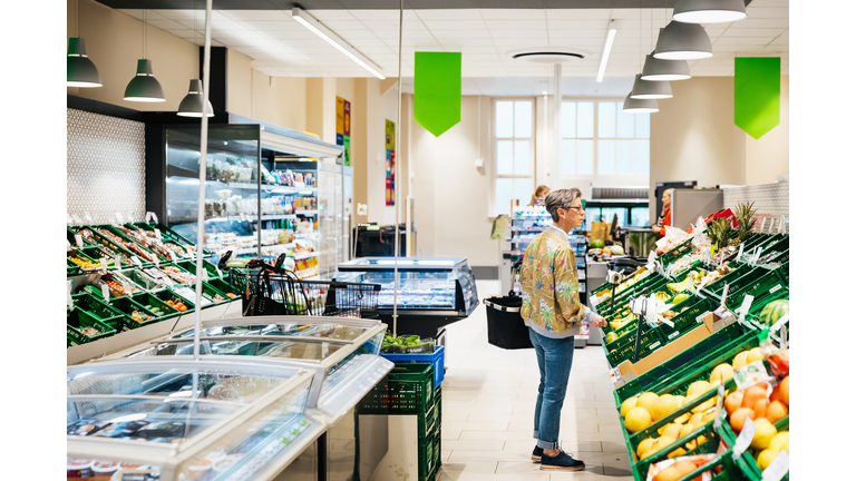 Senior Woman Shopping For Fruit And Vegetables