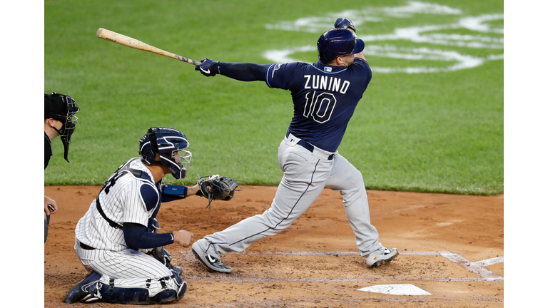 Mike Zunino crushes a home run off Gerrit Cole in the third inning of the Rays' 4-2 win over the Yankees Wednesday night.