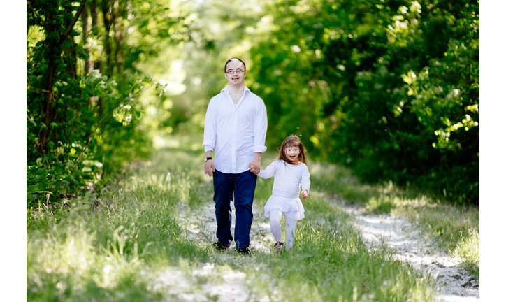 People with down sydrome walking in forest