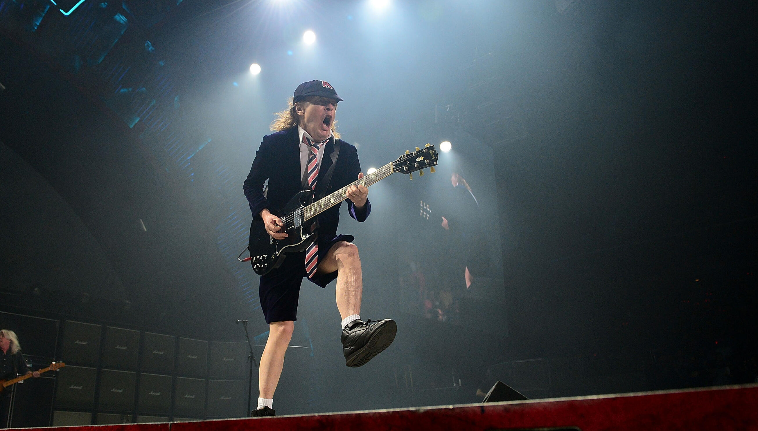 AC/DC's Angus Young Explains Why He's Always Moving Onstage iHeart