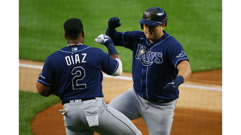 Ji-Man Choi of the Tampa Bay Rays celebrates with Yandy Diaz after hitting a two-run home run in the first inning against the New York Yankees