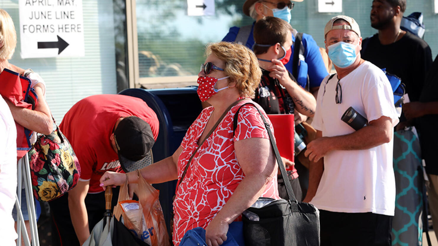 People Wait In Line To File For Unemployment Benefits In Frankfort, Kentucky