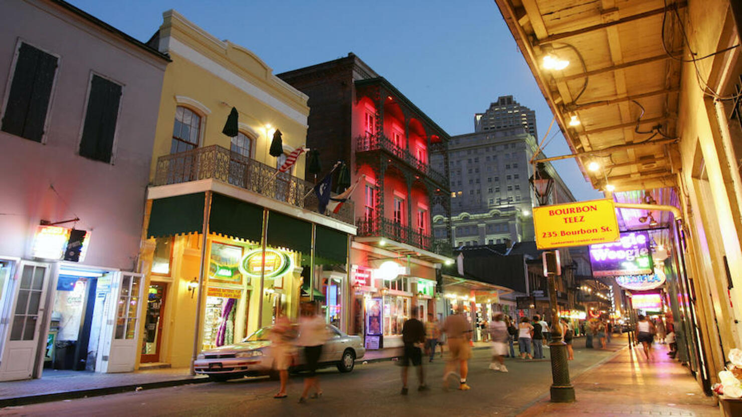 Dusk falls over Bourbon Street in the Fr