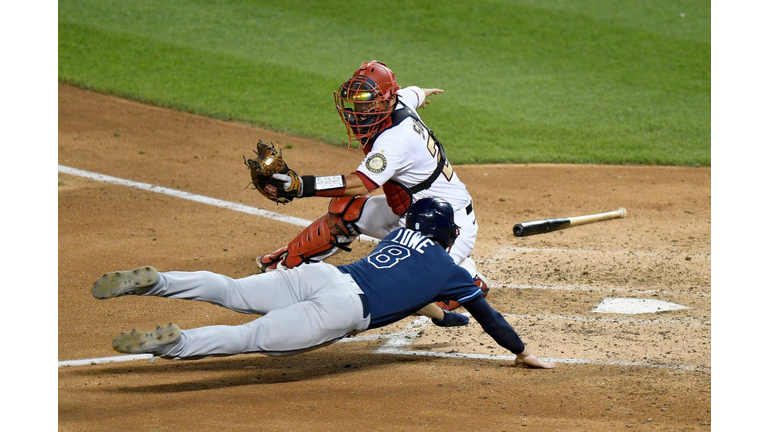 Brandon Lowe beats the throw home in the sixth inning of the Rays' 5-3 loss to the Washington Nationals Tuesday night.