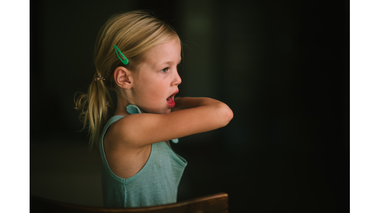 Young girl Cough or sneeze into her elbow; COVID-19; Coronavirus