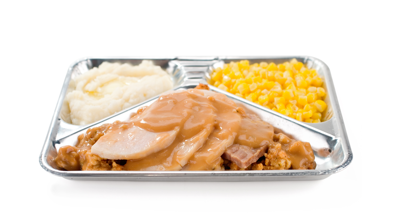 A TV dinner of turkey, sweet corn and mashed potatoes