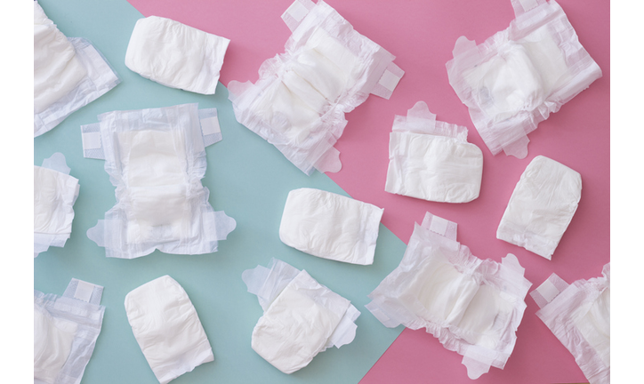 High Angle View Of Diapers Over Colored Background