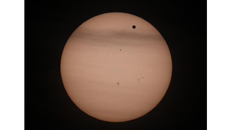 Planet Venus (R-black spot) transits in 