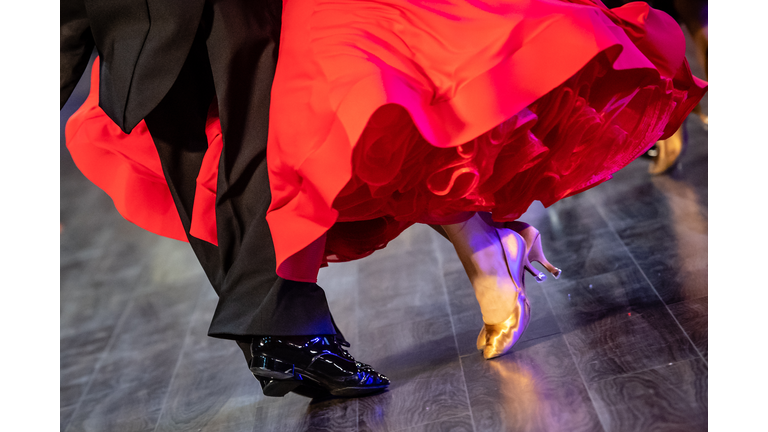 Low Section Of Couple Dancing On Floor