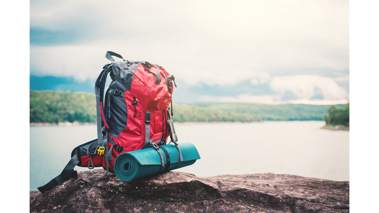 Close-Up Of Hiking Backpack On Rock By Lake