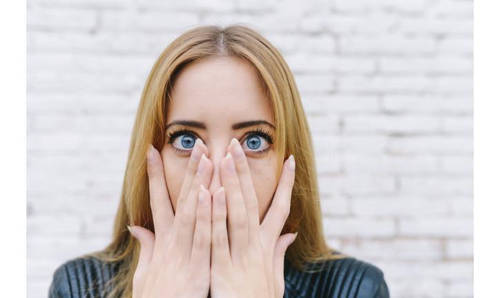 Portrait of surprised young woman