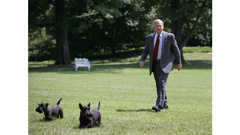US President George W. Bush walks on the
