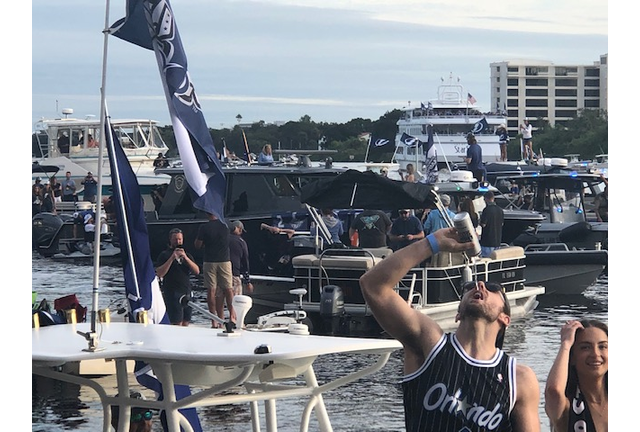 Tampa Bay Lightning's Barclay Goodrow chugging a beer thrown to him from a fan on shore!