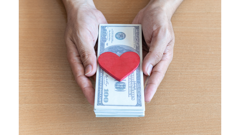 Directly Above Shot Of Person Holding Heart Shape On Table