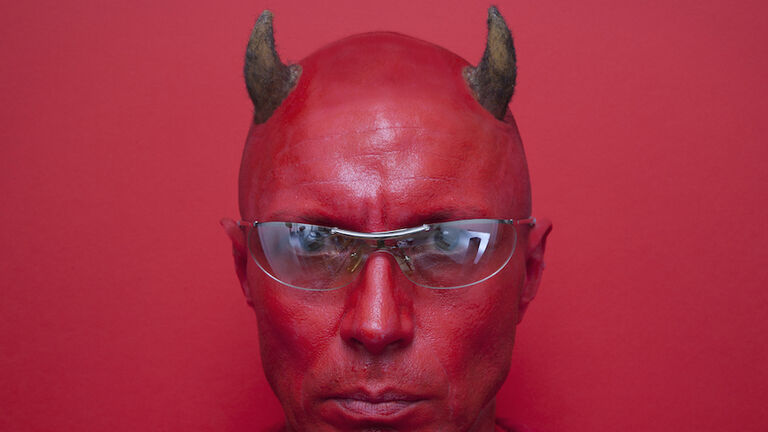Portrait of a devil in sunglasses.