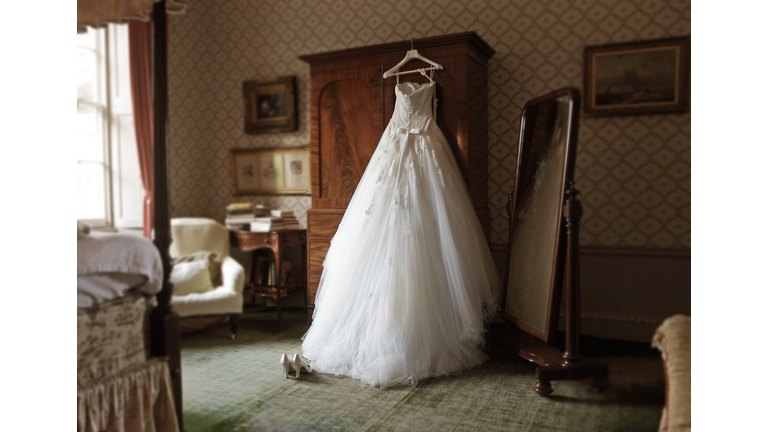 wedding dress in hotel room